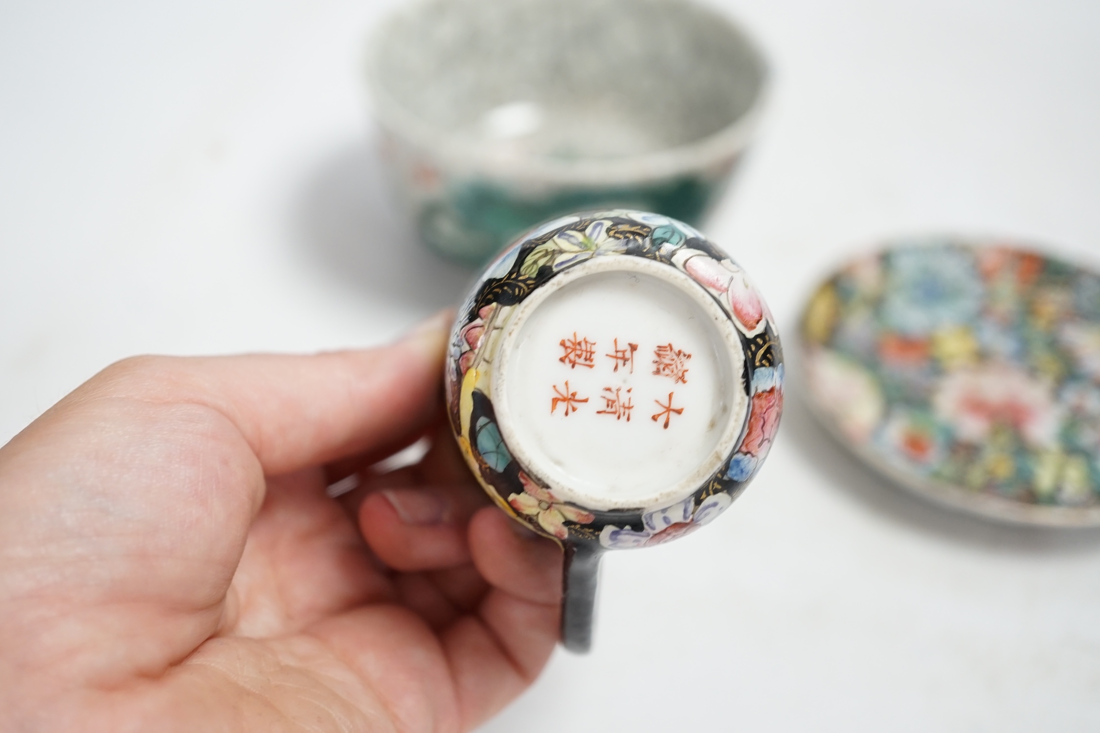 A Chinese crackleglaze famille verte ‘dragon’ bowl and a millefleur cup and saucer, bowl 11cm diameter. Condition - fair